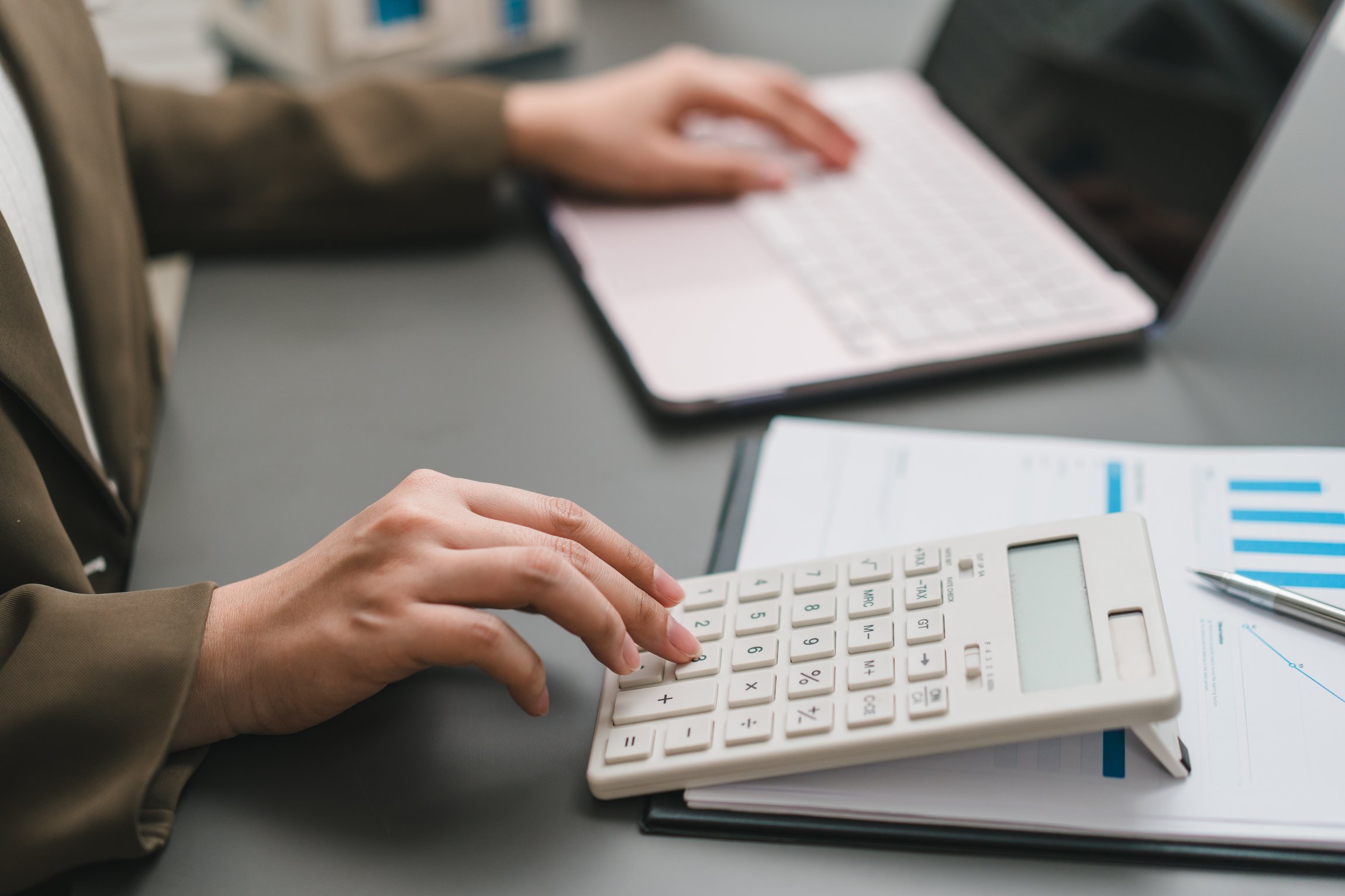 np_Accountant auditting financial budget with calculator_4mRrge_standard_photo